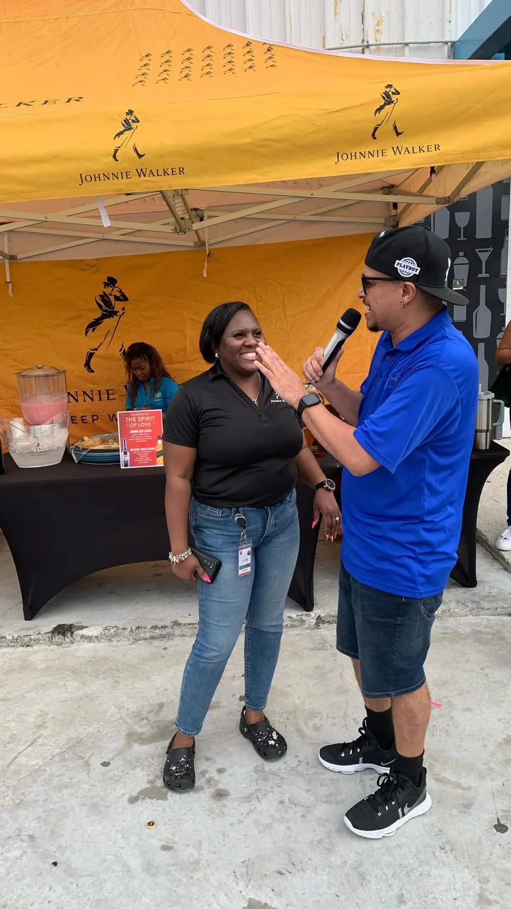 More 94 host with microphone at live remote event