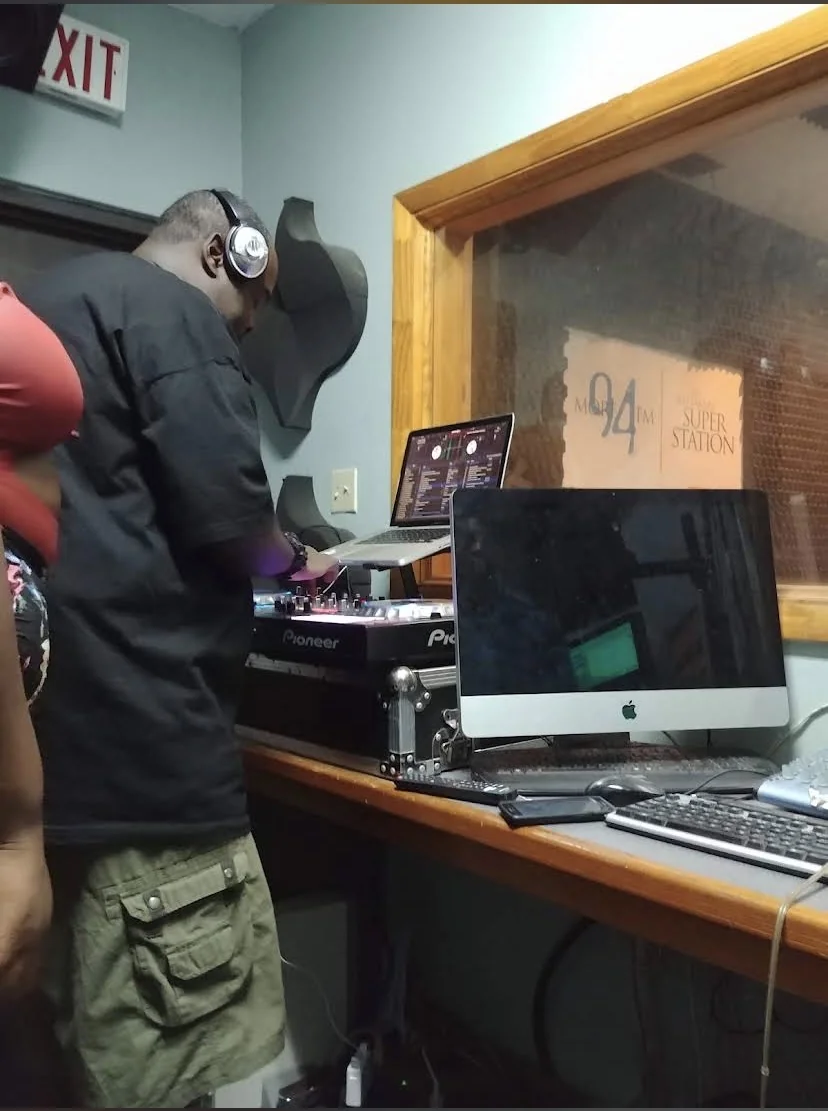 More 94 DJ at Pioneer mixer in studio